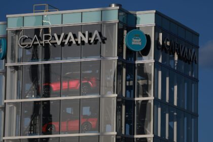 Stocks making the biggest moves in the afternoon: Carvana, Goldman Sachs, AT&T