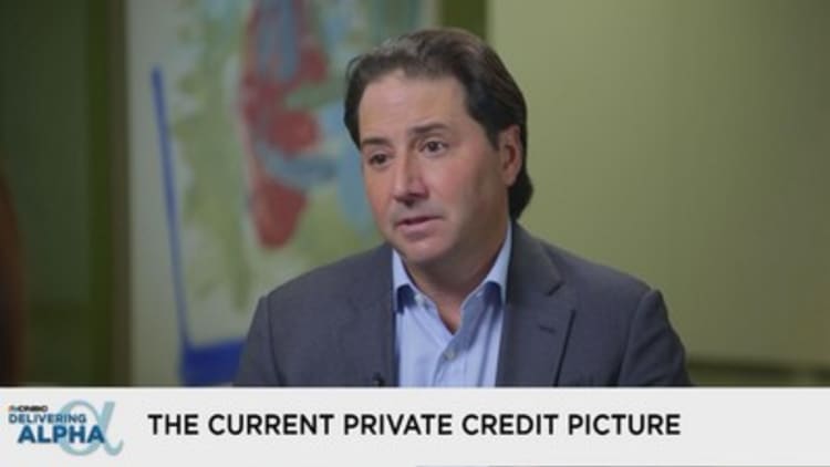 CEO of private credit giant Ares says his firm is benefitting from rising rates