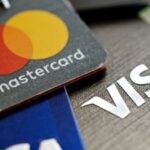 Interest rates, fees under fire as credit card debt tops $1 trillion