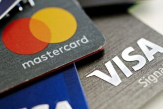 Interest rates, fees under fire as credit card debt tops $1 trillion