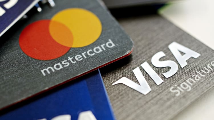Interest rates, fees under fire as credit card debt tops $1 trillion