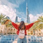 Femal tourist looking at a building in Dubai