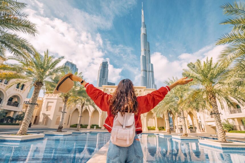 Femal tourist looking at a building in Dubai