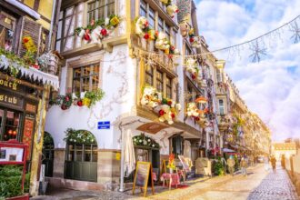 Strasbourg, Alsace, France Streets and facades of houses, traditionally decorated with toys and teddy bears for Christmas in medieval city of Strasbourg - the capital of Christmas