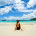 young traveler relaxes on a beautiful beach in st thomas us virgin islands