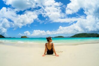 young traveler relaxes on a beautiful beach in st thomas us virgin islands