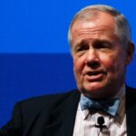 Legendary investor Jim Rogers sees an epic market bubble and looming economic disaster. He hopes to short the 'Magnificent 7' stocks when the time is right.