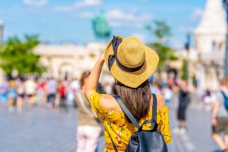 Woman traveler in Budapest, Hungary with a backpack on