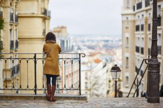 Woman standing on a street in Paris