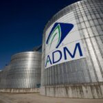 ADM Places CFO on Leave, Cuts Earnings Forecast Amid Probe