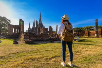 female solo traveler at thai temple