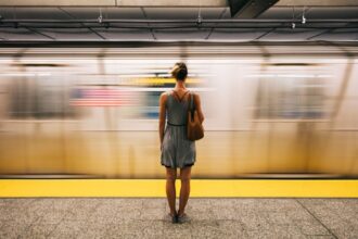 Woman in front of subway in New York