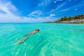 Woman swimming in Tulum
