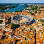 Aerial View Of Arles, A Historic Roman Era City In Provence, A Region In Southern France, Southern Europe
