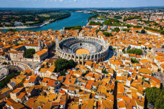 Aerial View Of Arles, A Historic Roman Era City In Provence, A Region In Southern France, Southern Europe