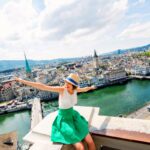 Woman posing in front of the Zurich cityscape, Switzerland