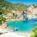 View Of A Scenic White Sand Beach In Corfu, Greece, Ionian Sea Of The Mediterranean, Southern Europe