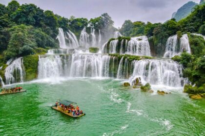 Tourist boat visiting Ban Gioc waterfalls in Cao Bang, Vietnam