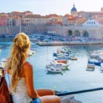 Young Woman Admiring A View Of Dubrovnik, Croatia