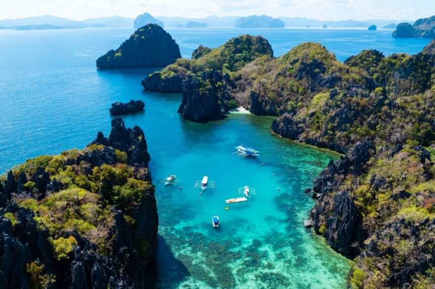 a stunning view of rocks formation and clear water of El Nido Palawan, Philippines.