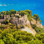 Hidden Coves & Crystal Clear Waters This Affordable MediteChateau De Cassis, Francerranean Town Is The Perfect Fall Getaway