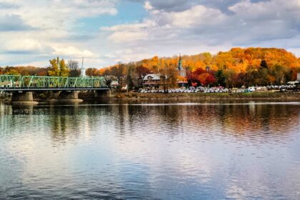 Bridge over Delaware River backdropped by fall foliage in New Hope, PA