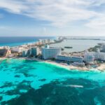 Sweeping views of Cancun resorts and aqua blue water