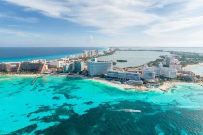 Sweeping views of Cancun resorts and aqua blue water