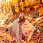 Happy woman in fall foliage