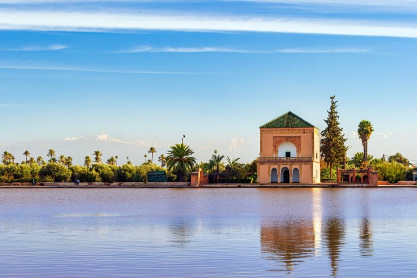 Saadian Pavillon at Menara gardens with Atlas mountains in Marrakech, Morocco