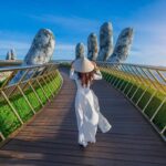 Young Woman Walking The Hand Bridge In Vietnam, Southeast Asia