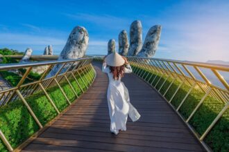 Young Woman Walking The Hand Bridge In Vietnam, Southeast Asia