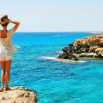 Woman enjoying the view from Cape Greco, Cyprus