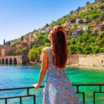 Woman near the Red Tower and castle in Alanya, Antalya, Turkey