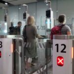 Travelers Using eGates At The Airport