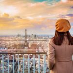 Woman overlooking Paris and the Eiffel Tower