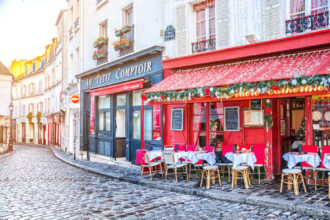 Cobbled cafe-lined street in Paris in winter