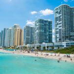 People swimming at nice beach in Sunny Isles, FL