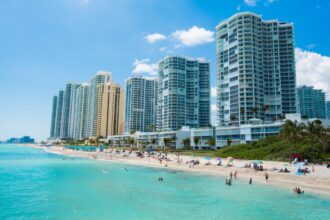 People swimming at nice beach in Sunny Isles, FL