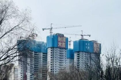 In China, Putting a Roof on a Half-finished Building Is Cause for Celebration