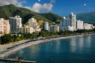View of Santa Marta, Colombia coast backdropped by rolling hills