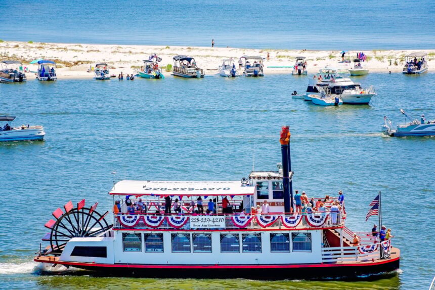 The Betsy Ann riverboat passing white sand beach in Biloxi