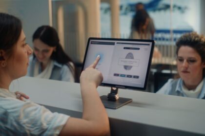 A Passenger Giving Their Fingerprints At An Airport