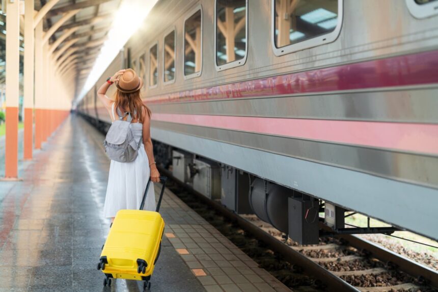 Female with luggage at train station