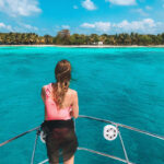 Young Woman Admiring A View Of An Island In The Caribbean Sea, Belize
