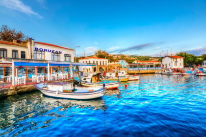 Boats docked at vibrant bozcaada, Turkiye waterfront