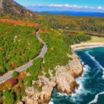 Lush forestry and blue water coastline of Acadia National Park