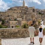 Couple walking through Matera, Italy