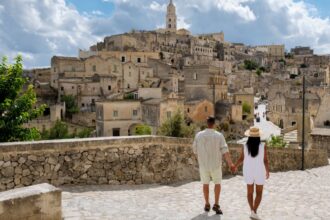 Couple walking through Matera, Italy