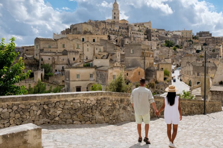 Couple walking through Matera, Italy